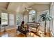 Sunroom showcasing natural light through large windows and comfortable seating area at 2123 Floral Ridge Dr, Dacula, GA 30019