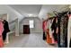Spacious walk-in closet with shelving and ample storage space for clothes and accessories at 2123 Floral Ridge Dr, Dacula, GA 30019