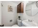 Cozy half-bath with classic fixtures, modern sink, mirror, and decorative accents at 2202 Green Forrest Dr, Decatur, GA 30032