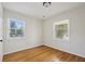 Bright bedroom with hardwood floors and ample natural light from two windows at 2202 Green Forrest Dr, Decatur, GA 30032