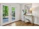 Cozy entry with French doors, hardwood floors, a console table and a stylish decor at 2202 Green Forrest Dr, Decatur, GA 30032