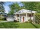Traditional home with a well-manicured lawn, brick facade, wooden shutters, and inviting front entrance at 2202 Green Forrest Dr, Decatur, GA 30032