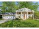 Charming traditional home with a well-manicured lawn, brick facade, and inviting front entrance at 2202 Green Forrest Dr, Decatur, GA 30032