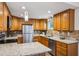 Updated kitchen featuring granite countertops, stainless steel appliances, tile backsplash, and wood cabinets at 2202 Green Forrest Dr, Decatur, GA 30032