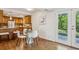 Cozy kitchen with wood cabinets, granite countertops, stainless steel appliances, and access to the backyard at 2202 Green Forrest Dr, Decatur, GA 30032