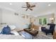 Bright living area with a ceiling fan, comfortable seating, and access to the backyard through French doors at 2202 Green Forrest Dr, Decatur, GA 30032