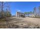 Expansive backyard with deck, fenced perimeter, offering privacy and room to roam at 7751 Capps Ridge Ln, Douglasville, GA 30135