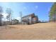 Expansive backyard featuring a deck, perfect for outdoor living and entertaining at 7751 Capps Ridge Ln, Douglasville, GA 30135