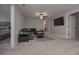 Finished basement rec room features a large entertainment area and neutral colors at 7751 Capps Ridge Ln, Douglasville, GA 30135