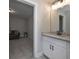 Bathroom featuring granite countertop, undermount sink, and modern lighting at 7751 Capps Ridge Ln, Douglasville, GA 30135