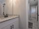 Bathroom featuring granite countertop, modern faucet, and tiled floor at 7751 Capps Ridge Ln, Douglasville, GA 30135