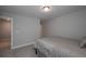 Bright bedroom featuring neutral carpeting, queen bed, and natural light at 7751 Capps Ridge Ln, Douglasville, GA 30135