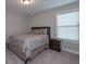 Comfortable bedroom with large window, queen bed, and nightstand at 7751 Capps Ridge Ln, Douglasville, GA 30135