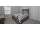 This cozy bedroom features a comfortable bed and a tranquil, neutral color scheme at 7751 Capps Ridge Ln, Douglasville, GA 30135