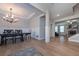 Elegant dining room showcasing hardwood floors, a modern chandelier, and decorative wall trim at 7751 Capps Ridge Ln, Douglasville, GA 30135