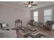 Cozy living room with neutral tones, plush seating, stylish decor, and lots of natural light at 7751 Capps Ridge Ln, Douglasville, GA 30135