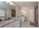 Elegant main bathroom featuring double vanity and glass enclosed shower at 7751 Capps Ridge Ln, Douglasville, GA 30135