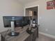 Home office with two monitors, wooden desk, and natural light at 7751 Capps Ridge Ln, Douglasville, GA 30135