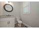 Charming powder room with granite countertop and classic fixtures at 7751 Capps Ridge Ln, Douglasville, GA 30135