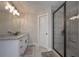 Walk-in shower with custom tile work and modern fixtures in the bath at 7751 Capps Ridge Ln, Douglasville, GA 30135