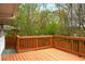 Back deck overlooking a lush, wooded yard, perfect for outdoor relaxation at 974 Shirley Se St, Smyrna, GA 30082