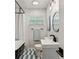 Cozy bathroom with black and white checkered floors and modern decor and fixtures at 974 Shirley Se St, Smyrna, GA 30082