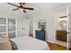 Serene bedroom connecting to a modern bathroom, featuring sleek decor and hardwood floors at 974 Shirley Se St, Smyrna, GA 30082