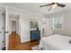 Spacious bedroom with hardwood floors, light-filled windows, and access to other rooms at 974 Shirley Se St, Smyrna, GA 30082