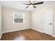 Cozy bedroom features hardwood floors, ceiling fan, natural light, and access to a closet at 974 Shirley Se St, Smyrna, GA 30082