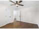 Bedroom with hardwood floors, neutral walls, and doors to a hallway and closet at 974 Shirley Se St, Smyrna, GA 30082