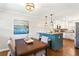 Charming dining area with a view of the breakfast bar, and modern light fixtures at 974 Shirley Se St, Smyrna, GA 30082