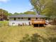 Charming home featuring a spacious backyard with a wooden deck for outdoor enjoyment at 974 Shirley Se St, Smyrna, GA 30082