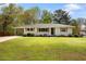 Charming one-story home with gray brick, wood shutters and landscaped yard at 974 Shirley Se St, Smyrna, GA 30082