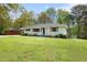 Lovely one-story home with gray brick, wood shutters, and well-maintained lawn at 974 Shirley Se St, Smyrna, GA 30082