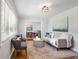 Bright living room with neutral decor, hardwood floors, and modern furnishings at 974 Shirley Se St, Smyrna, GA 30082