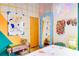 Bright eclectic bedroom with colorful walls, a large mirror, and unique decor accents at 130 Arizona Ne Ave # 415, Atlanta, GA 30307