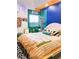 Vibrant bedroom featuring a unique bed frame, colorful walls, and eclectic decor elements at 130 Arizona Ne Ave # 415, Atlanta, GA 30307