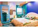 Eclectic bedroom featuring colorful walls, unique decor, and a large bed with stylish bedding at 130 Arizona Ne Ave # 415, Atlanta, GA 30307