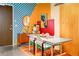 Stylish dining area with colorful walls, a modern table, and artistic decor at 130 Arizona Ne Ave # 415, Atlanta, GA 30307