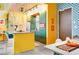 Bright kitchen boasts yellow and green cabinets, modern appliances, and unique patterned walls at 130 Arizona Ne Ave # 415, Atlanta, GA 30307