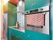 Chic kitchen showcases modern appliances, sleek cabinetry, and stylish tile backsplash at 130 Arizona Ne Ave # 415, Atlanta, GA 30307