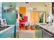 A pass through kitchen with with blue green lower cabinets, a stove top and a dinning area at 130 Arizona Ne Ave # 415, Atlanta, GA 30307