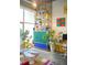 Living room showcasing designer furniture, bright shelving, and plenty of plants and natural light at 130 Arizona Ne Ave # 415, Atlanta, GA 30307