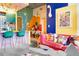 Stylish living room with bright walls, a cozy pink sofa, and an open layout leading to the kitchen at 130 Arizona Ne Ave # 415, Atlanta, GA 30307
