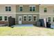 A view of the home's backyard featuring green grass and the back of the house at 1616 Ruskin Way, Marietta, GA 30062