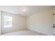 Bright, carpeted bedroom with a single window providing natural light at 1616 Ruskin Way, Marietta, GA 30062