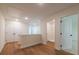 Hallway with hardwood floors, a large storage closet and white trim at 1616 Ruskin Way, Marietta, GA 30062