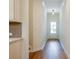 Inviting hallway with modern lighting and hardwood floors leading to the entrance at 1616 Ruskin Way, Marietta, GA 30062