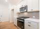 Well-equipped kitchen with stainless steel appliances and ample white cabinet space at 1616 Ruskin Way, Marietta, GA 30062