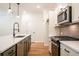 Open kitchen layout with stainless steel appliances and ample counter space at 1616 Ruskin Way, Marietta, GA 30062
